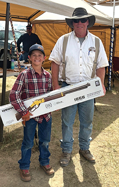 Dan Burgess with the $2,000 gift certificate donated by Shiloh Rifle Manufacturing, his plaque for winning the Small Fry Class and the pellet rifle donated by the Forsyth Rifle and Pistol Club.